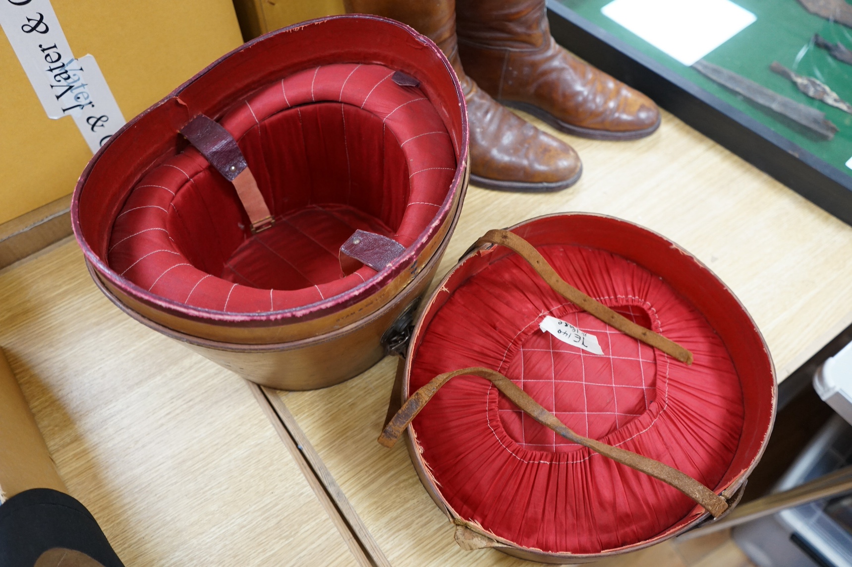 A pair of vintage leather riding boots and a leather cased top hat, ‘A.J. White, hatter to the Royal Family’. Condition - fair